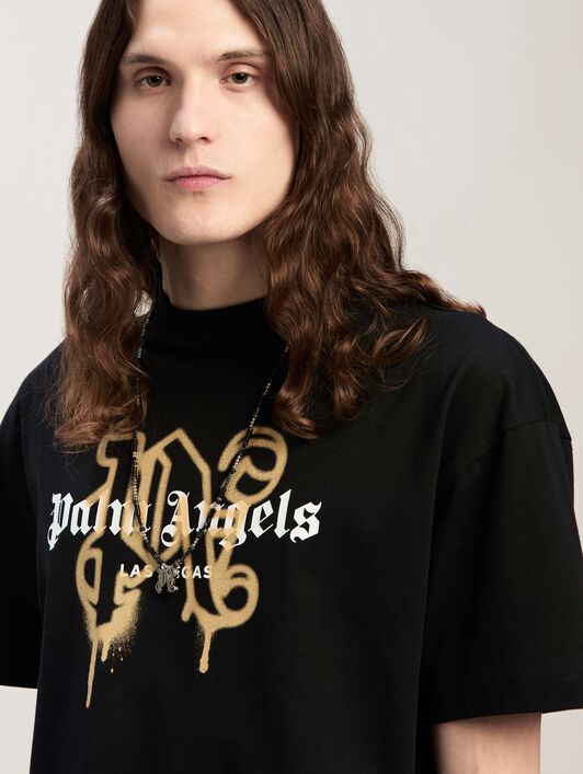 Las Vegas Monogram Spray Tee PALM ANGELS Las Vegas Monogram Spray Tee BLACK - GOLD PMAA001C99JER031