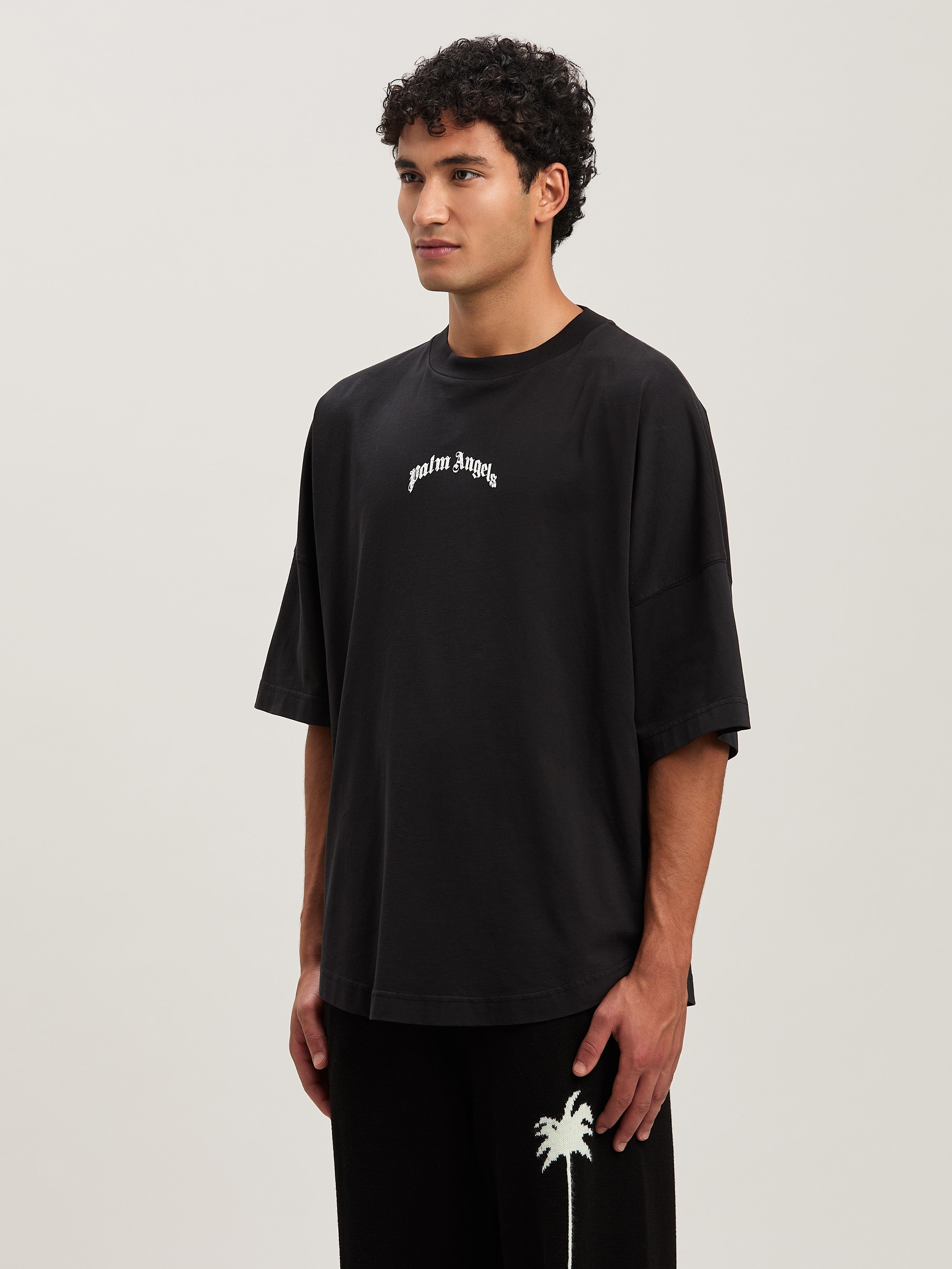 PALM ANGELS Oversize T-Shirt mit geschwungenem Logo BLACK - OFF WHITE PMAA002S25JER001