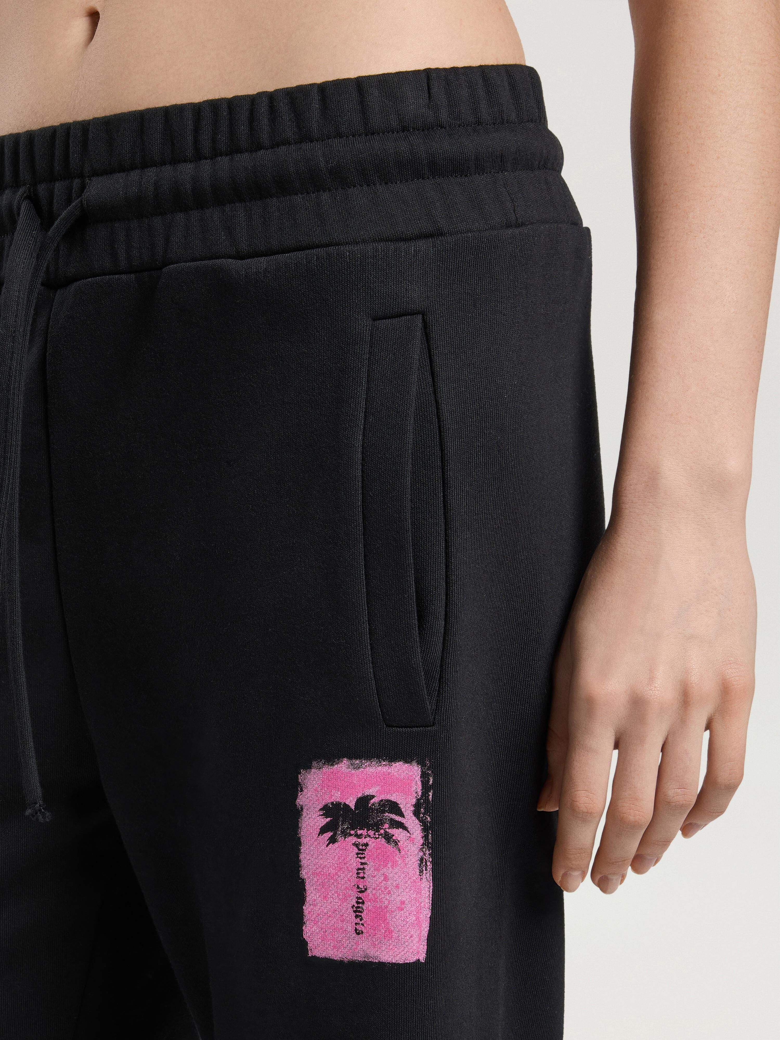 Brushed Palm Tree Sweatpants PALM ANGELS Brushed Palm Tree Sweatpants BLACK - PINK PAWCH02W26FL03