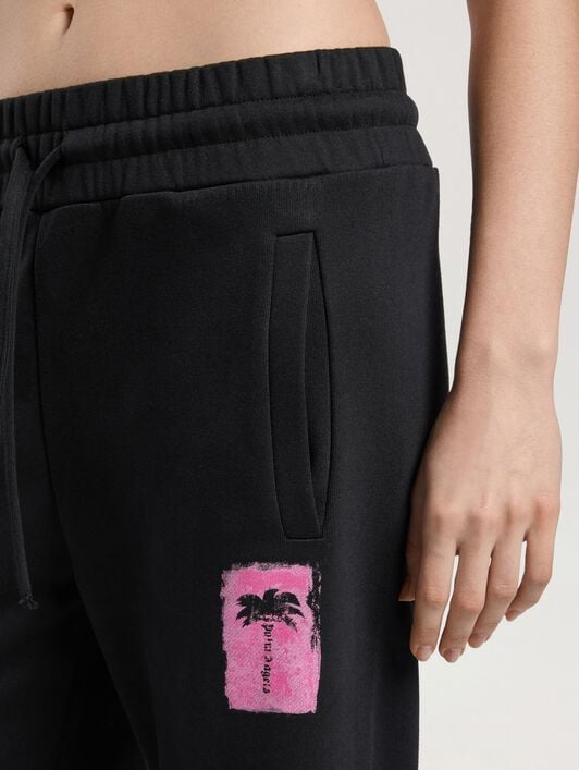 Brushed Palm Tree Sweatpants PALM ANGELS Brushed Palm Tree Sweatpants BLACK - PINK PAWCH02W26FL03