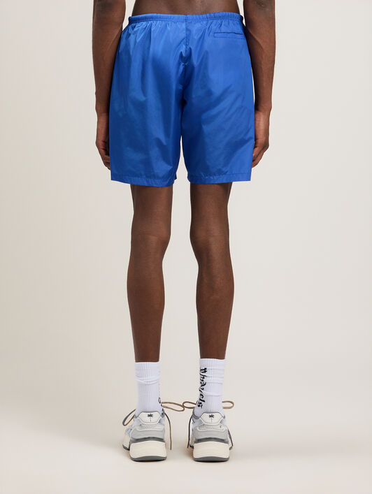 PALM ANGELS Curved Logo Swimshorts COBALT BLUE OFF WHITE PMFD018S26FAB001