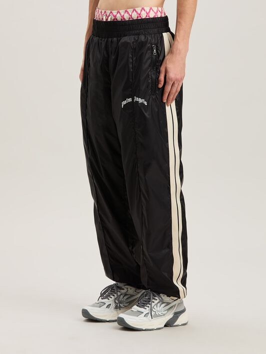 PALM ANGELS  Nylon Track Pants Curved Logo BLACK - GREY PMCA179S25FAB001