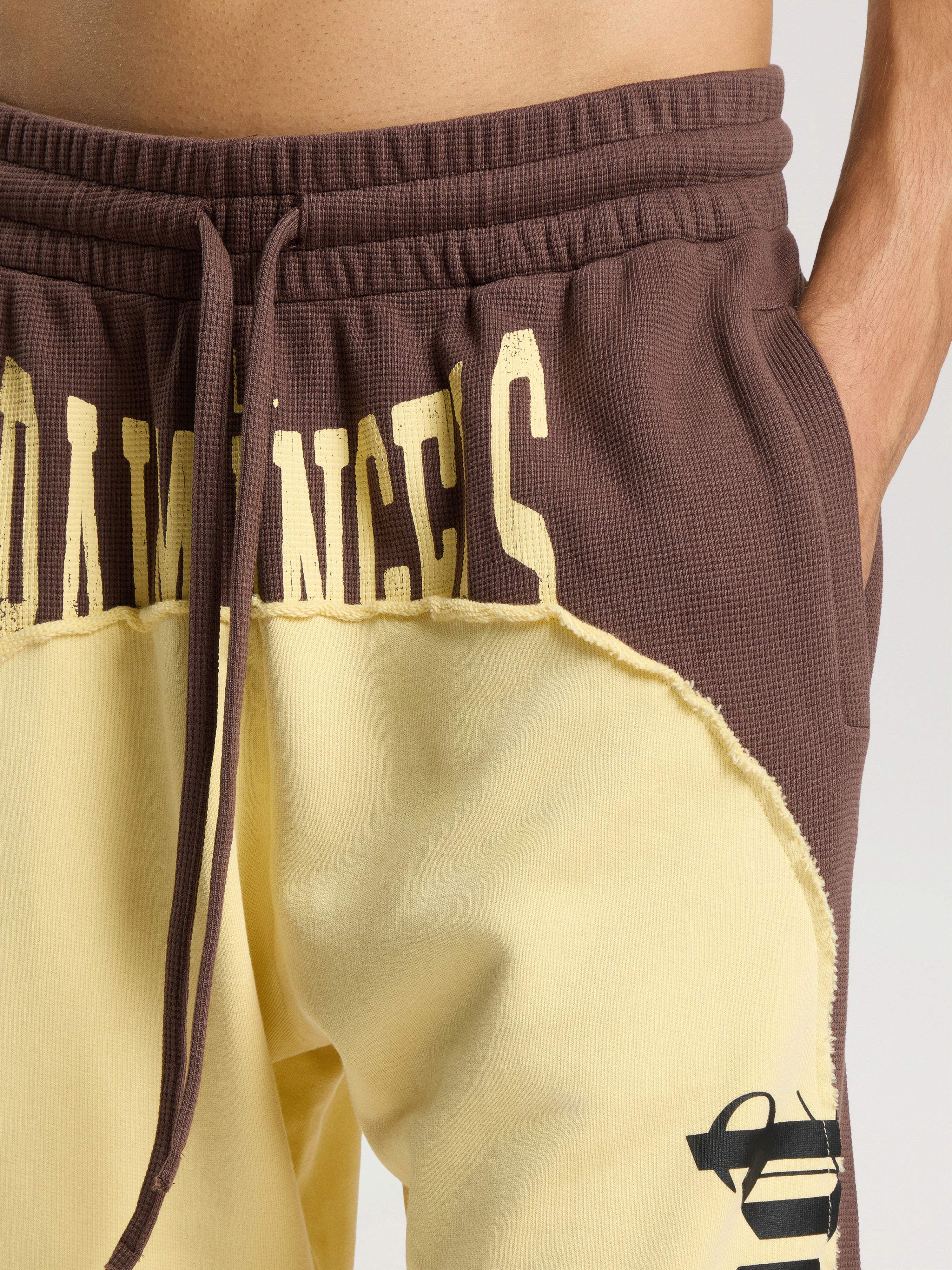 Vintage Logo Loose Sweatpants PALM ANGELS Vintage Logo Loose Sweatpants BROWN - LIGHT YELLOW PAMCH03F26FL01