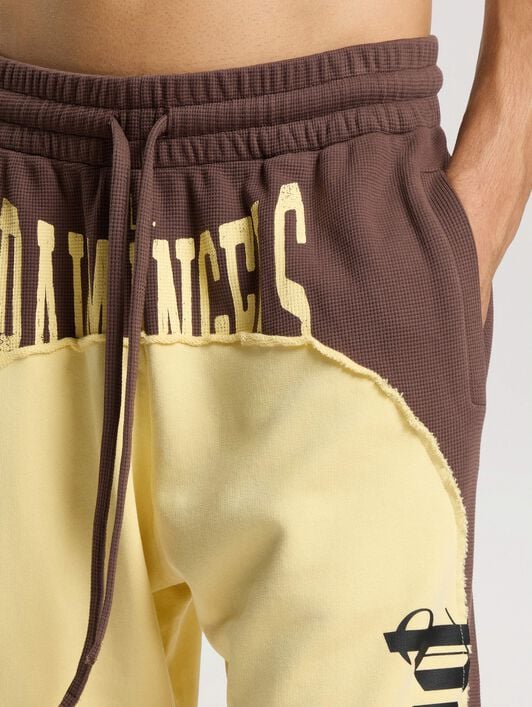 Vintage Logo Loose Sweatpants PALM ANGELS Vintage Logo Loose Sweatpants BROWN - LIGHT YELLOW PAMCH03F26FL01