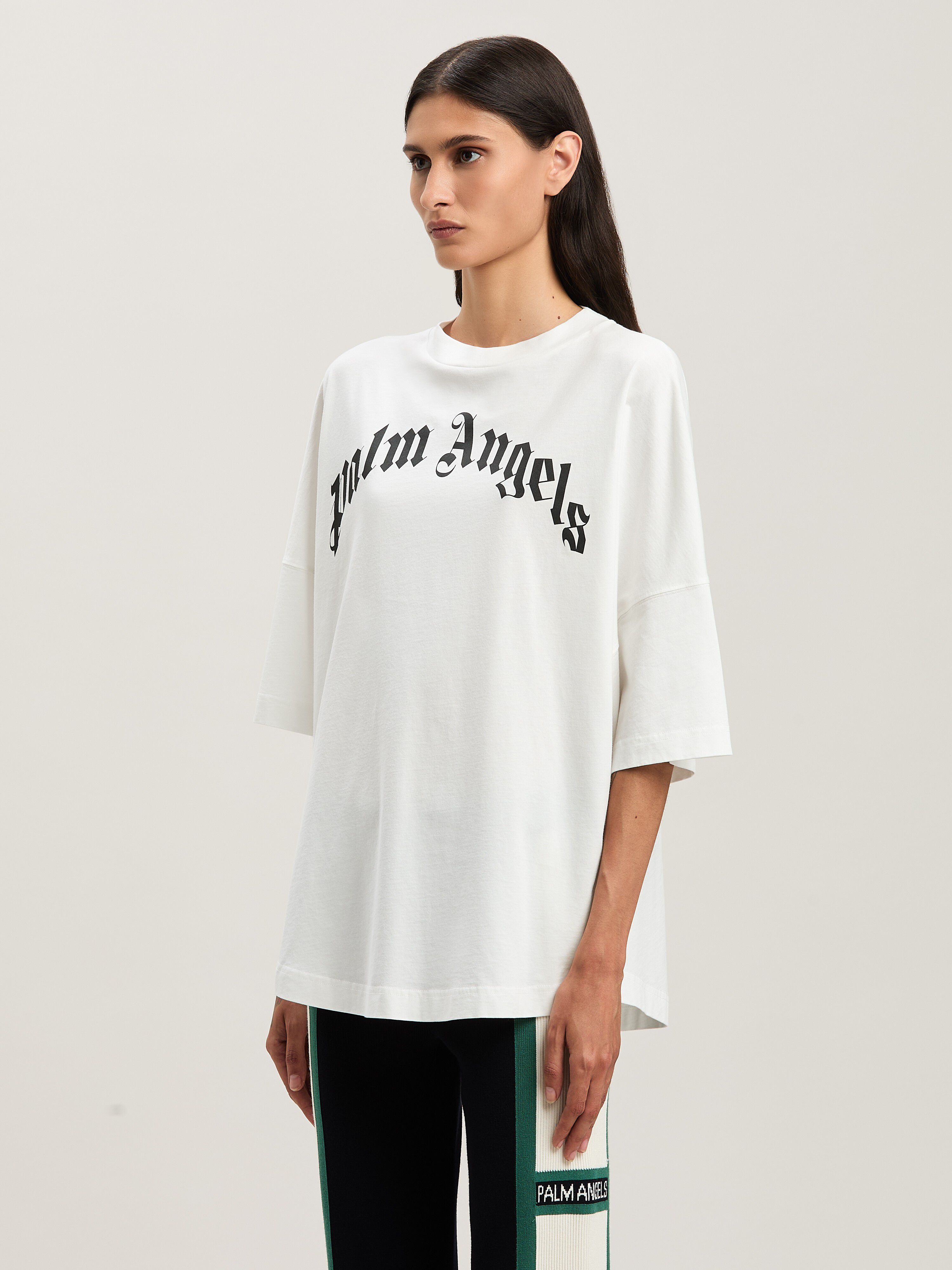 PALM ANGELS  Oversize T-Shirt mit geschwungenem Logo OFF WHITE - BLACK PWAA023S25JER001