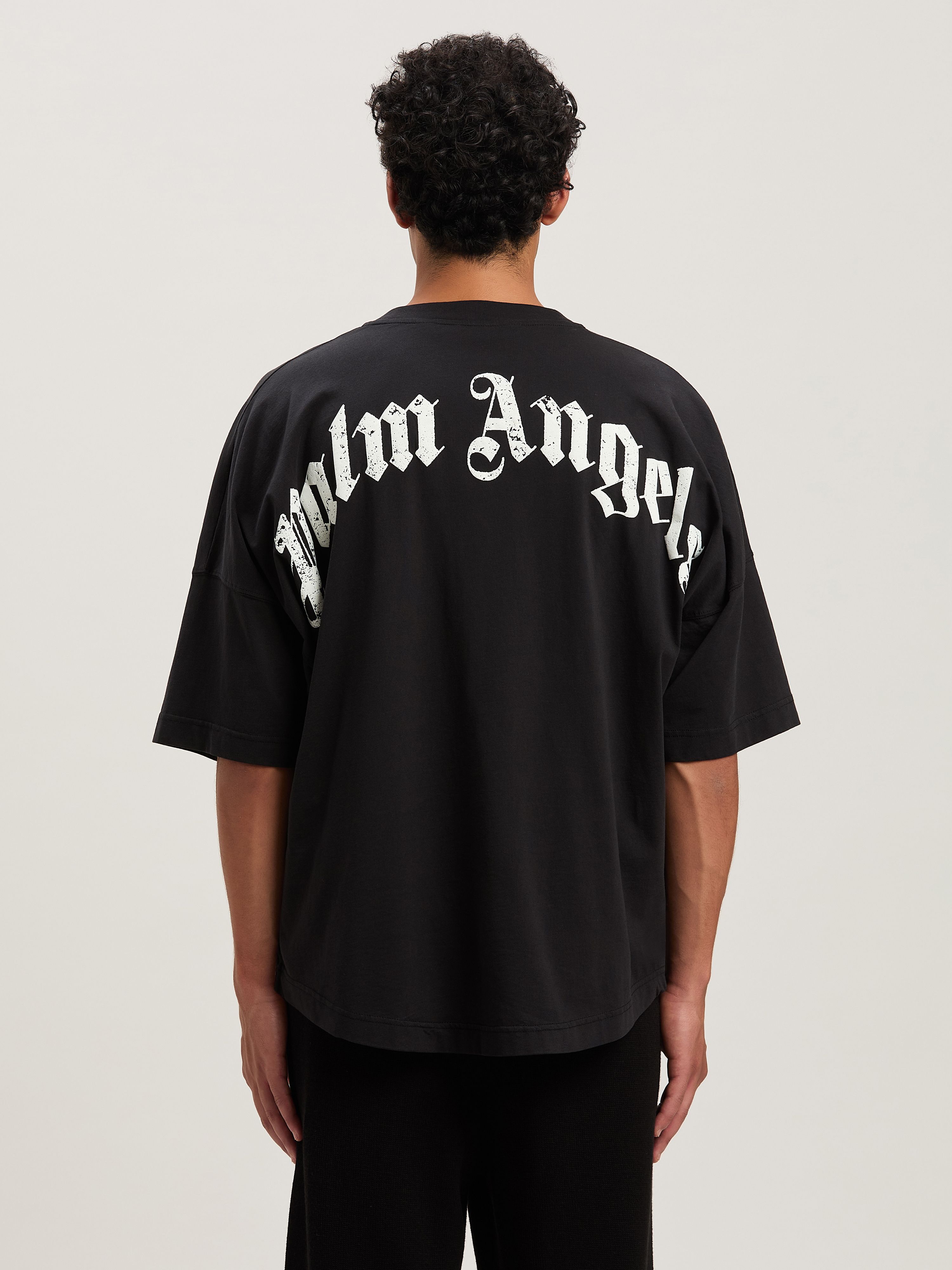 PALM ANGELS Oversize T-Shirt mit geschwungenem Logo BLACK - OFF WHITE PMAA002S25JER001