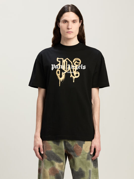 Las Vegas Monogram Spray Tee PALM ANGELS Las Vegas Monogram Spray Tee BLACK GOLD PMAA001C99JER031