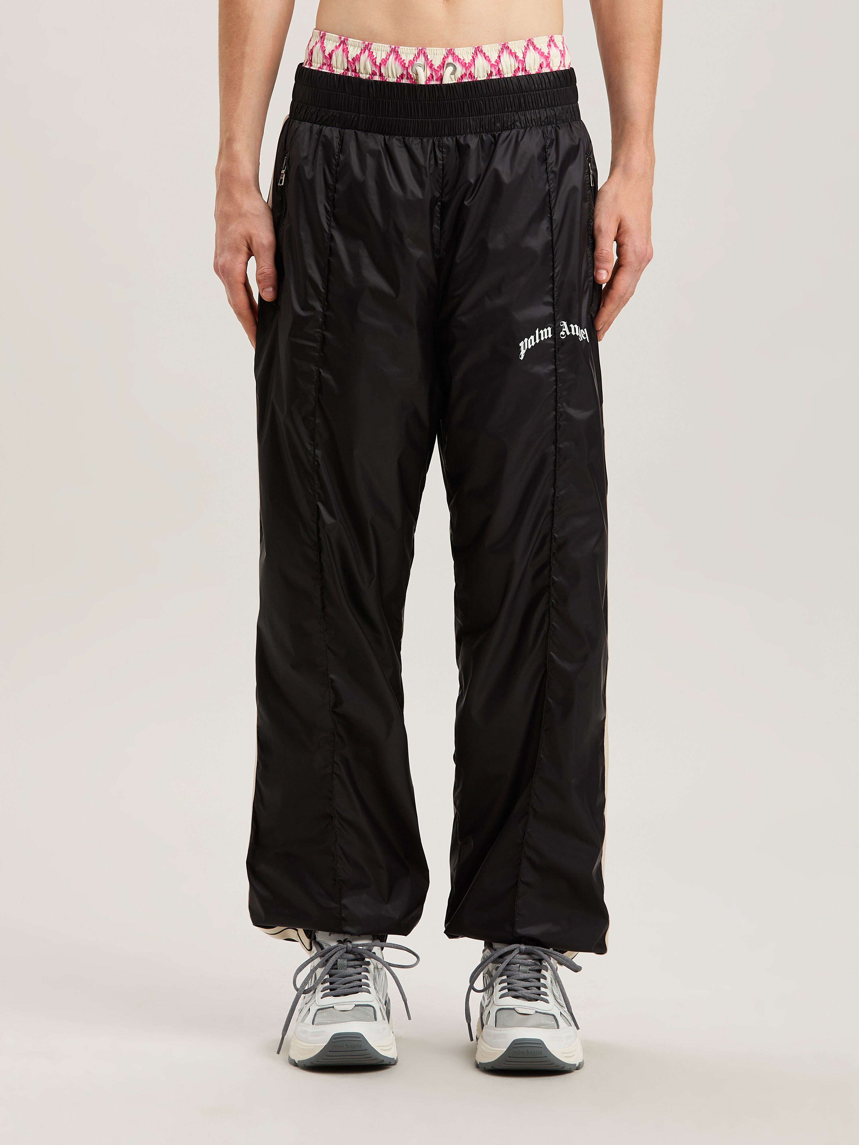PALM ANGELS  Nylon Track Pants Curved Logo BLACK - GREY PMCA179S25FAB001