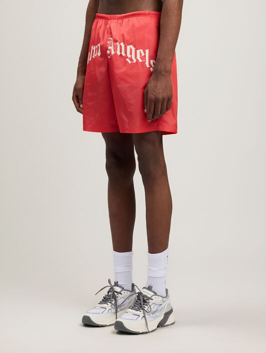 PALM ANGELS Curved Logo Swimshorts RED OFF WHITE PMFD018S26FAB001