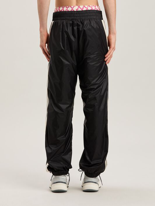 PALM ANGELS  Nylon Track Pants Curved Logo BLACK - GREY PMCA179S25FAB001