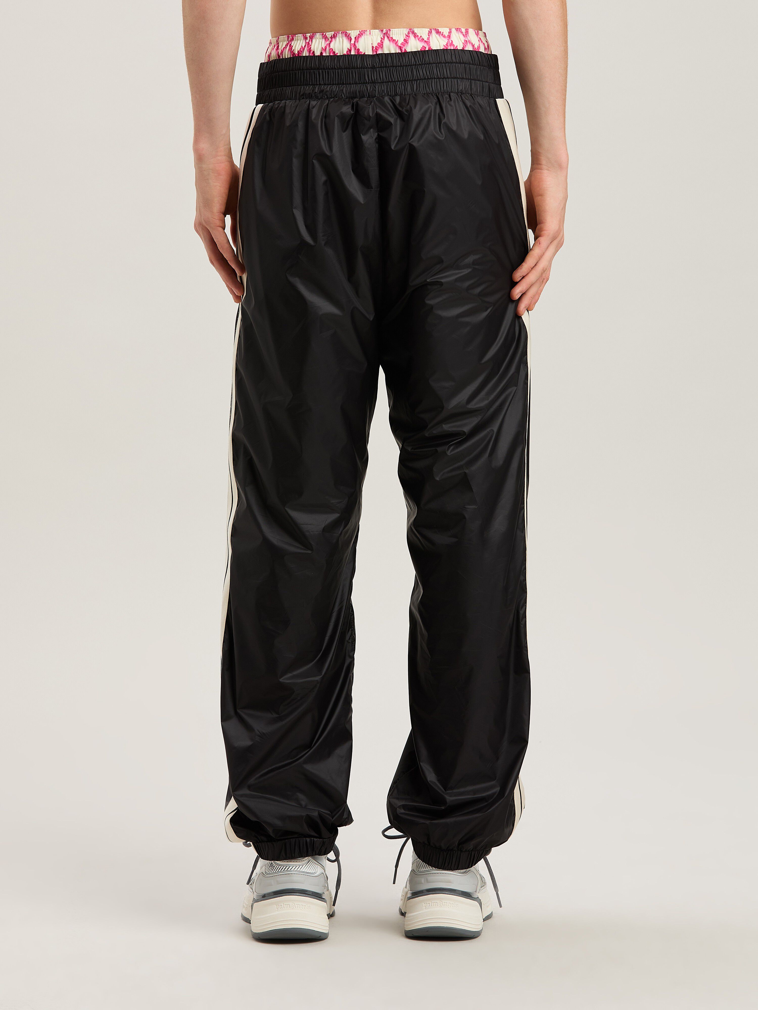 PALM ANGELS  Nylon Track Pants Curved Logo BLACK - GREY PMCA179S25FAB001