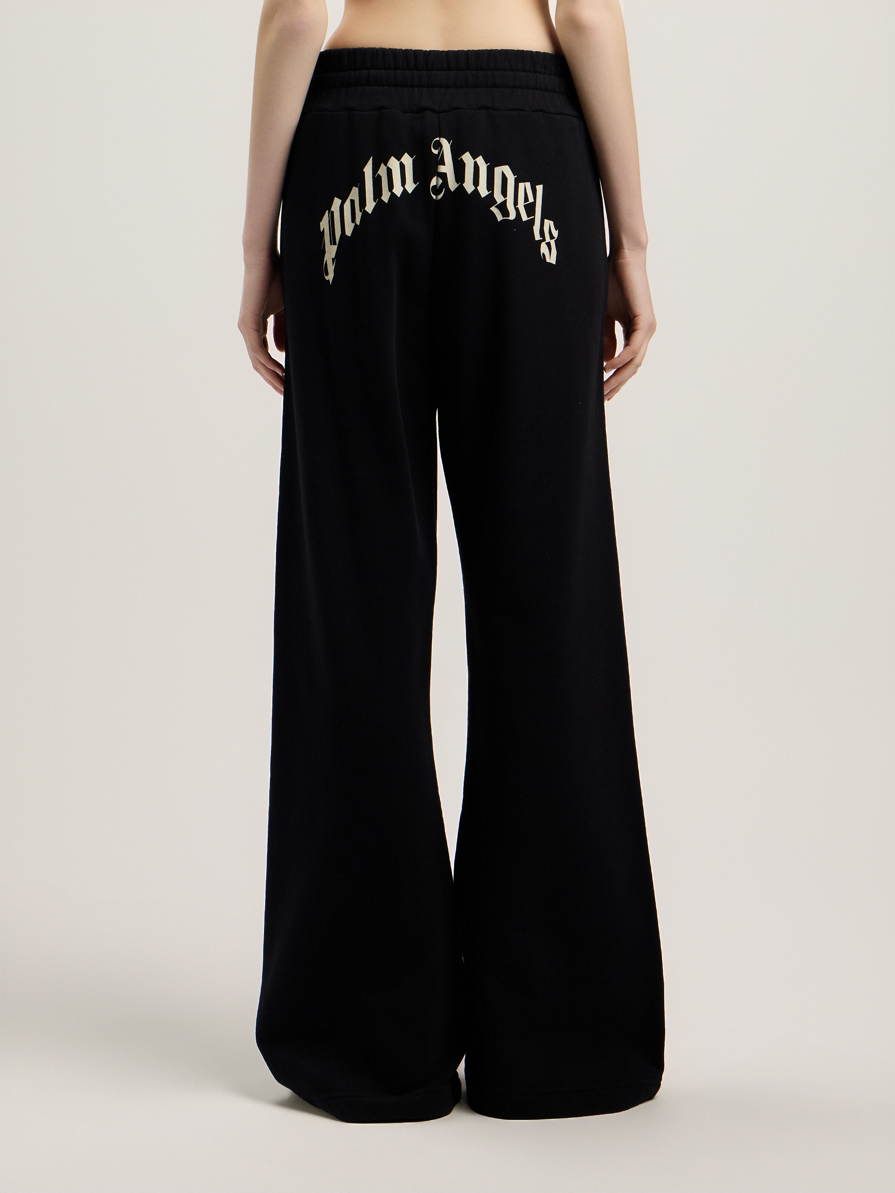 Curved Logo Sweatpants in BLACK TOFU for Women | Palm Angels®