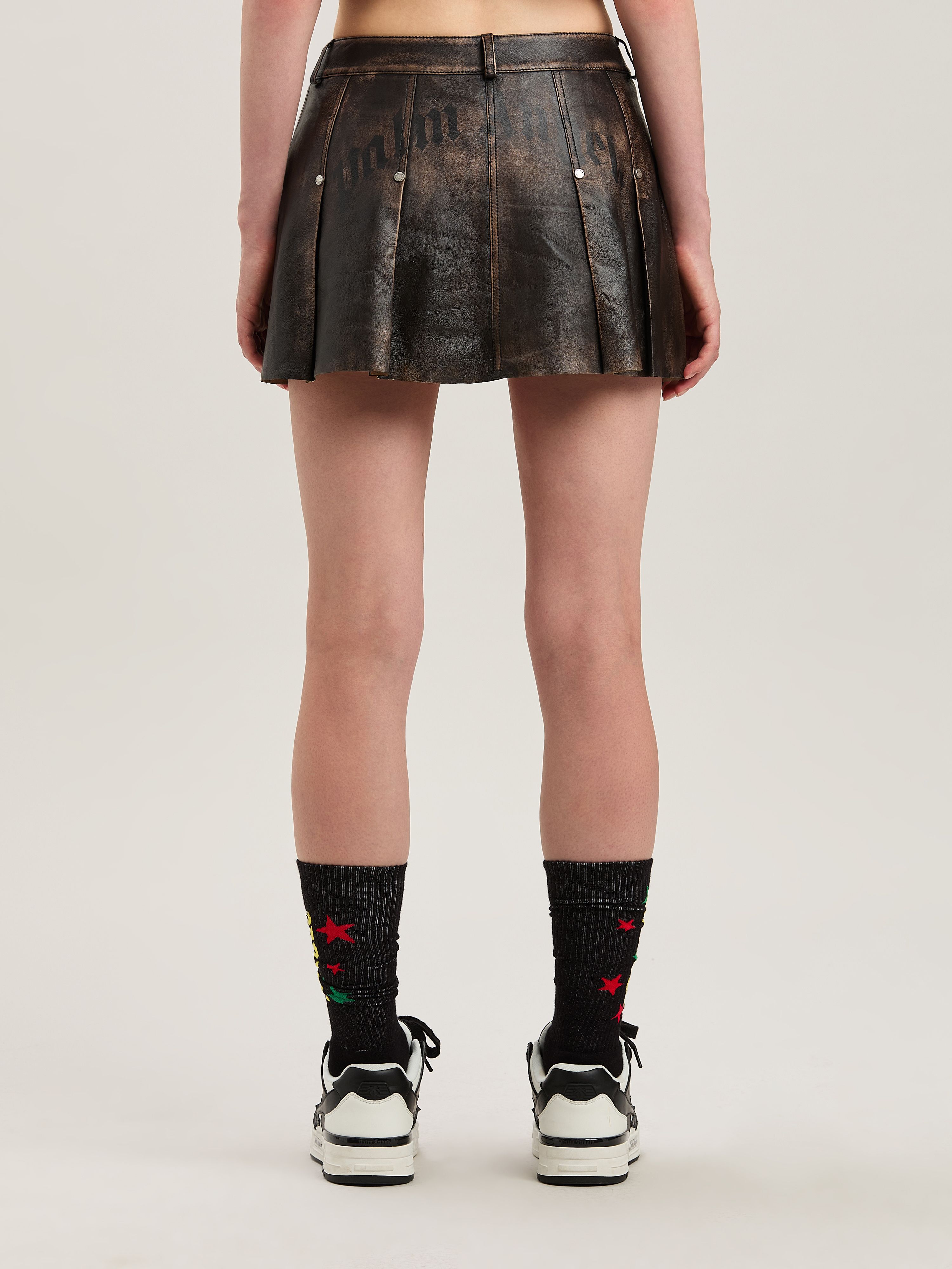 PALM ANGELS  Leder Minirock mit geschwungenem Logo BROWN - DARK BROWN PWJC011S25LEA001