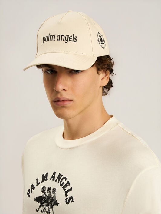PALM ANGELS Lion Herald Cap OFF WHITE - NAVY BLUE PALMB01W26FB03