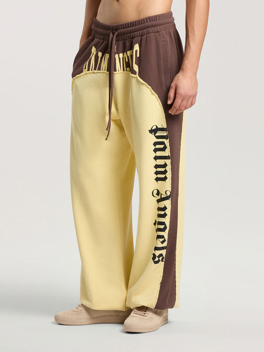 Vintage Logo Loose Sweatpants PALM ANGELS Vintage Logo Loose Sweatpants BROWN - LIGHT YELLOW PAMCH03F26FL01