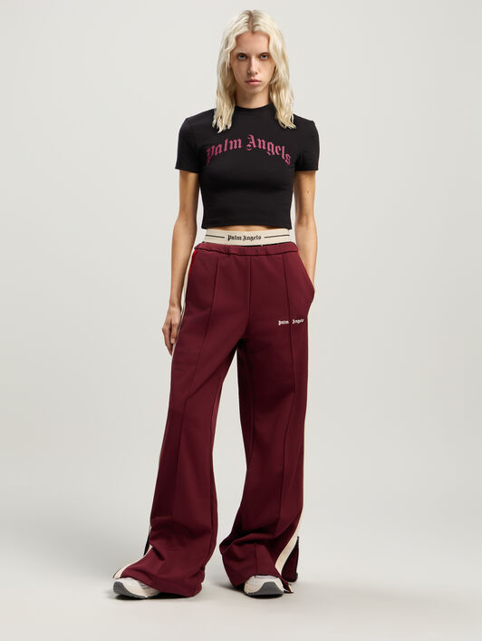 Curved Logo Baby Tee PALM ANGELS Curved Logo Baby Tee BLACK - FUCHSIA PWAA077F25JER002