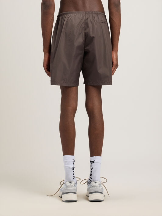 PALM ANGELS Curved Logo Swimshorts BROWN BLACK PMFD018S26FAB001