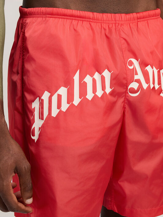 PALM ANGELS Curved Logo Swimshorts RED OFF WHITE PMFD018S26FAB001