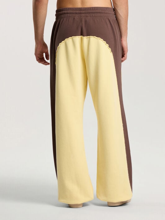Vintage Logo Loose Sweatpants PALM ANGELS Vintage Logo Loose Sweatpants BROWN - LIGHT YELLOW PAMCH03F26FL01