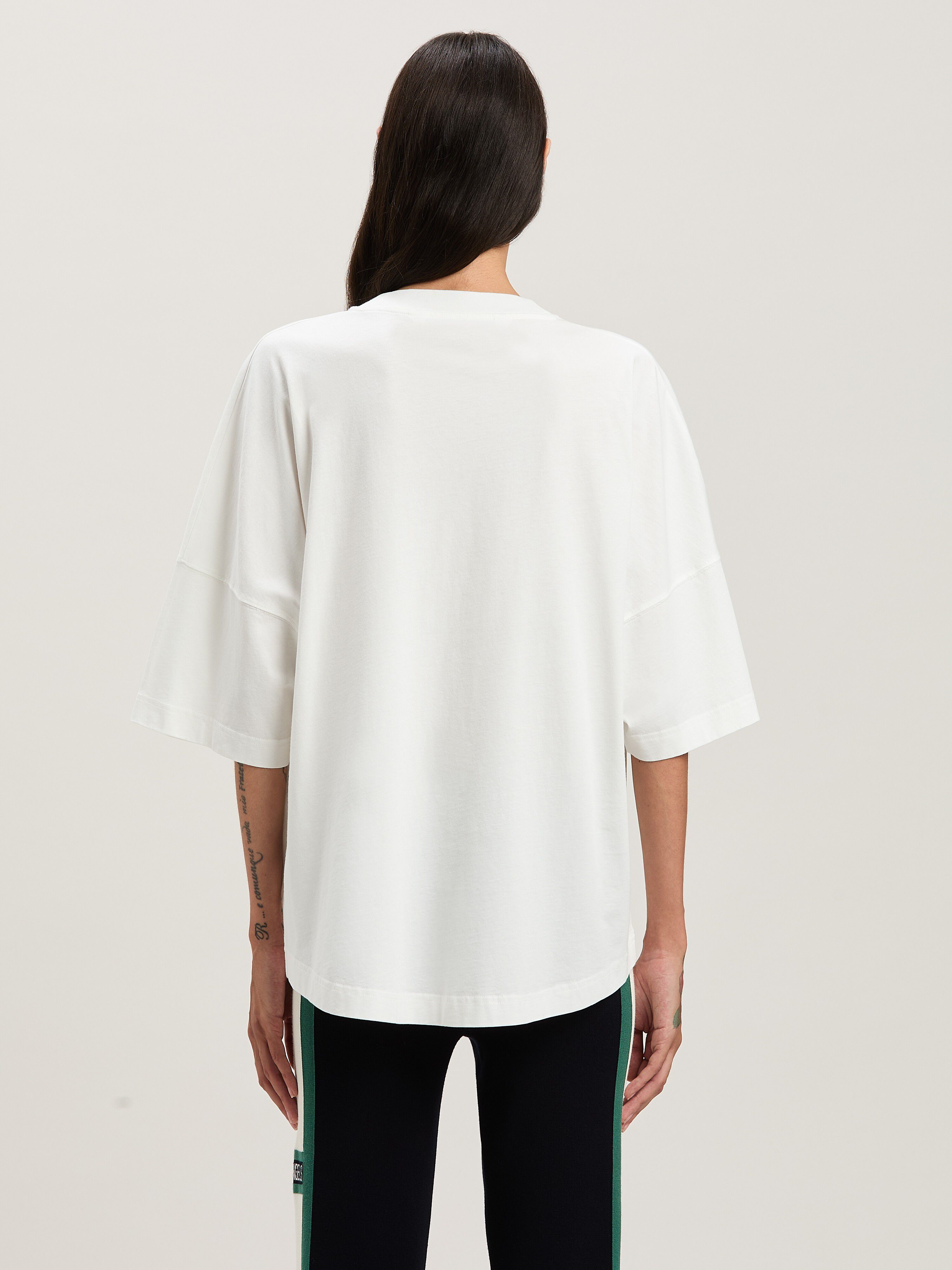 PALM ANGELS  Oversize T-Shirt mit geschwungenem Logo OFF WHITE - BLACK PWAA023S25JER001