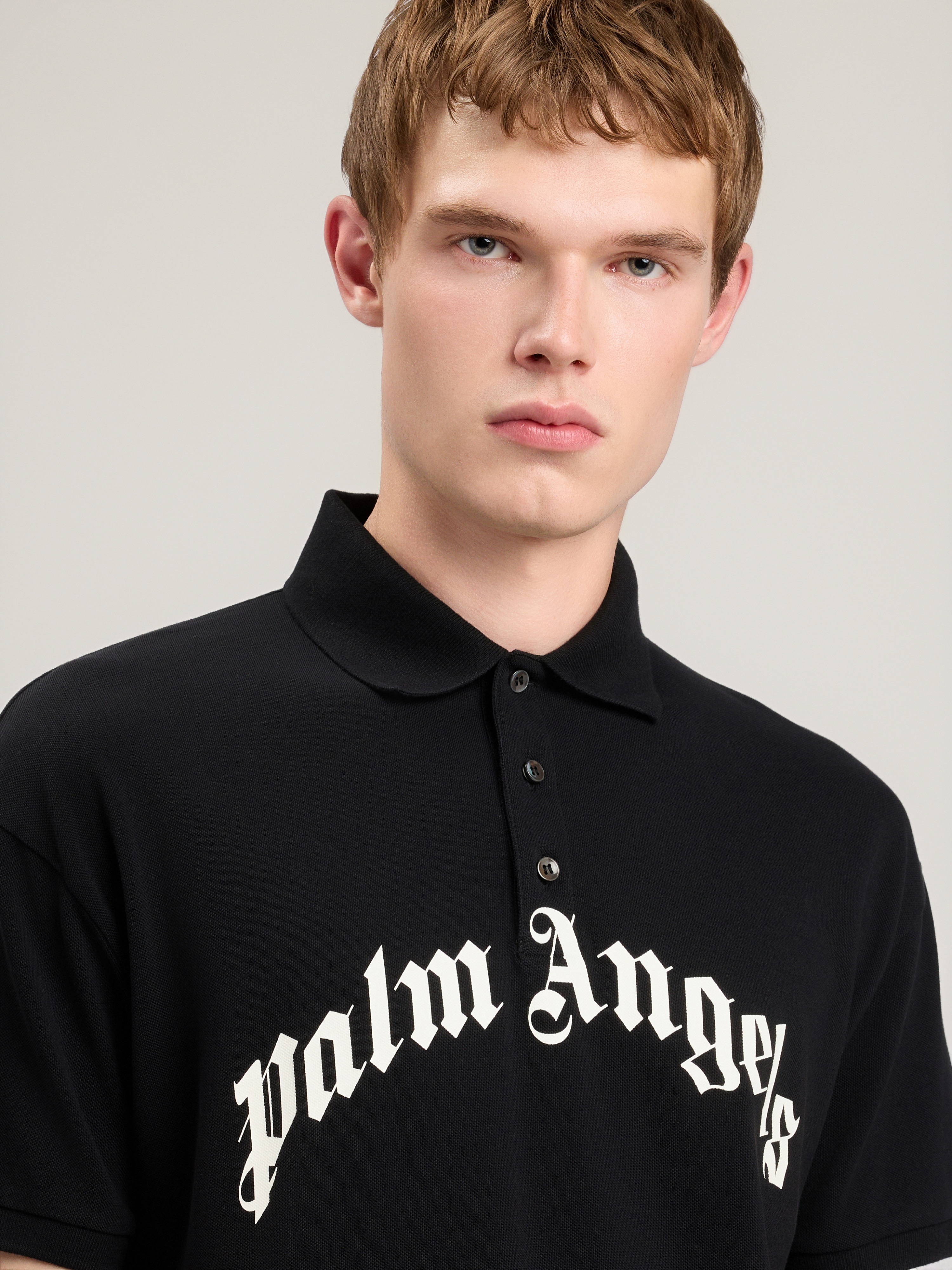 Palm Angels Curved Logo Embroidered Polo Shirt In Black