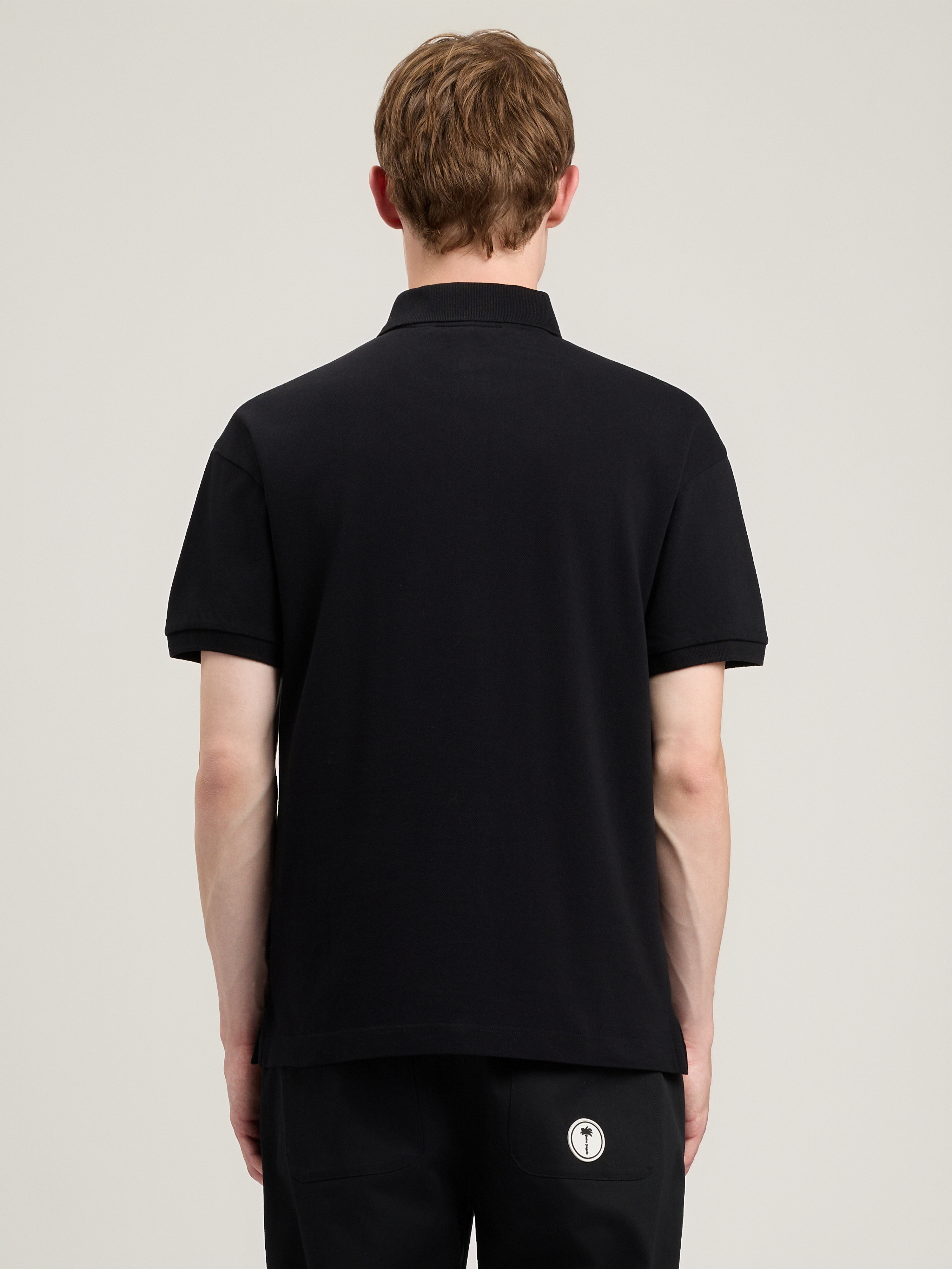 Palm Angels Curved Logo Embroidered Polo Shirt In Black