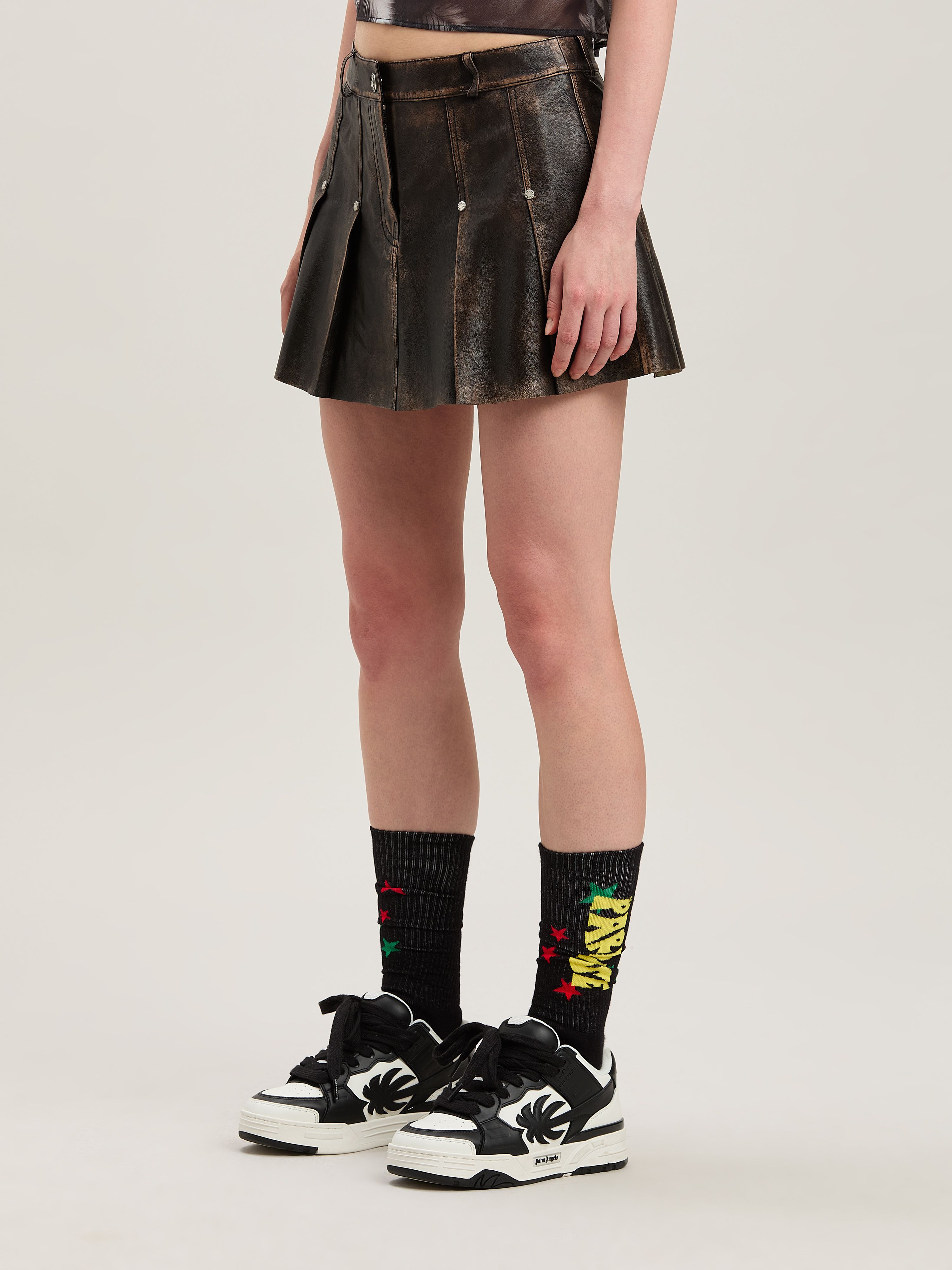 Shop Palm Angels Curved Logo Leather Miniskirt